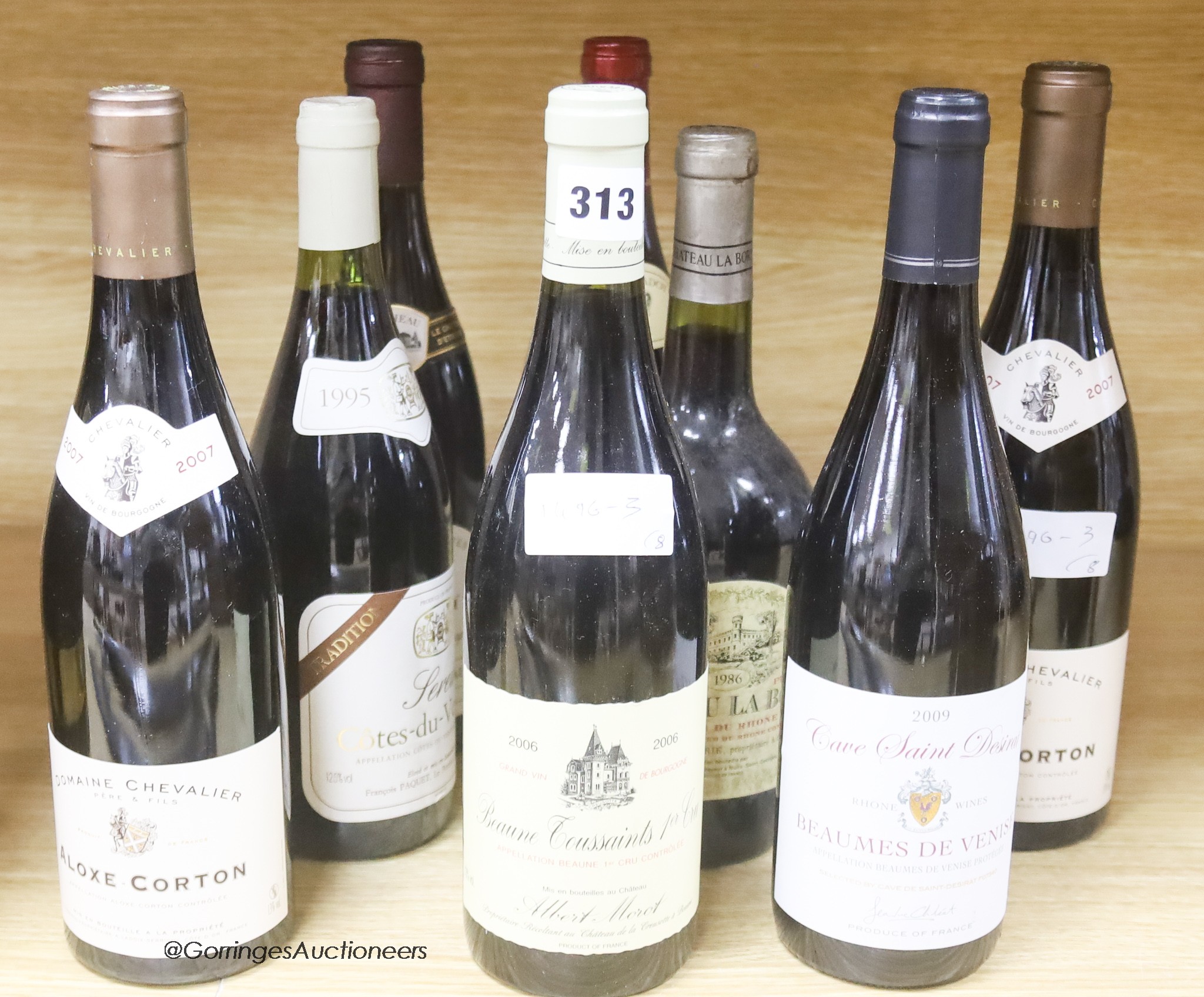 Seven assorted Burgundy wines including two Aloxe Corton Domaine Chevalier, 2007, together with one Chateau La Borie, Cotes du Rhône 1986.